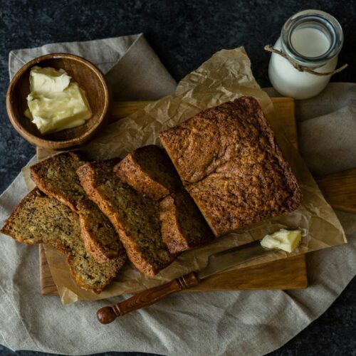 Freshly baked pumpkin banana bread with autumn accents.