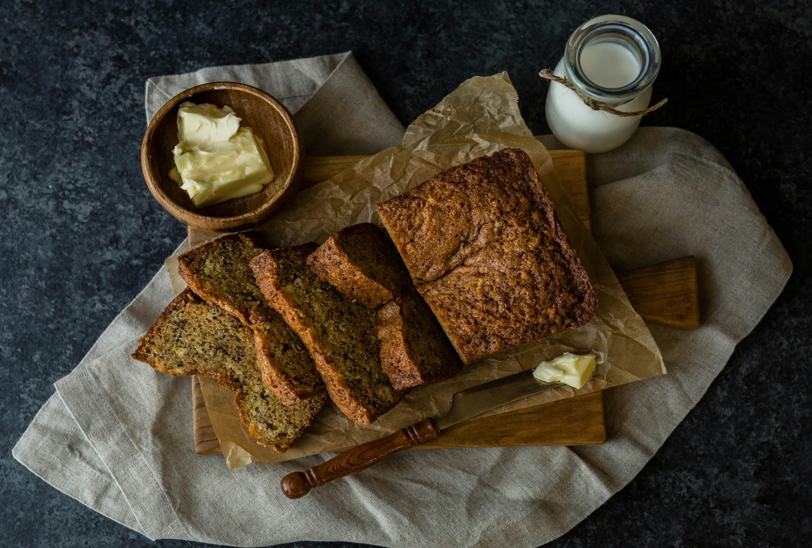 Freshly baked pumpkin banana bread with autumn accents.