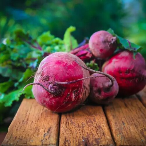 Fresh beetroots with leafy greens, perfect for a latte.