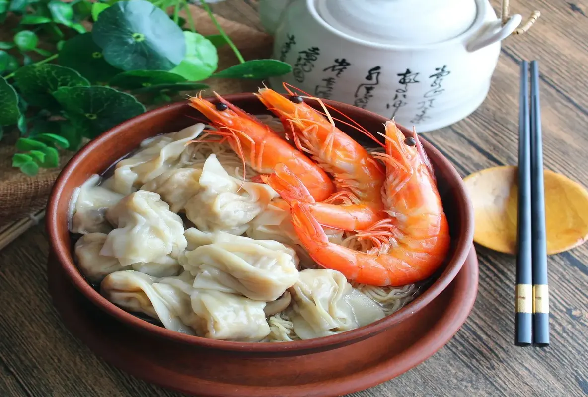 Traditional East Asian dish with dumplings and shrimp.