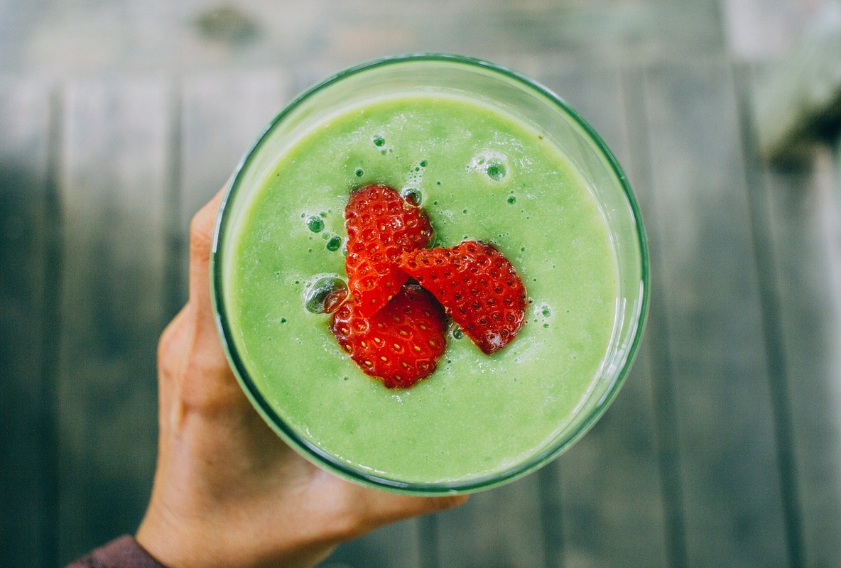 Fresh strawberries in a yellow bowl highlighting savoring spirulina bowl taste.