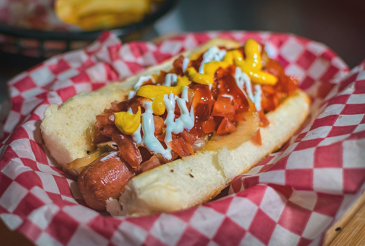 Japadog-style Terimayo hot dog with teriyaki sauce, mayo, sesame seeds, and green onions.